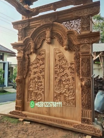 Model Pintu Ukir Relief Kupu Tarung Kayu Jati